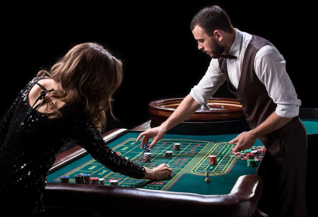 A Croupier placing chips on the Roulette Layout.